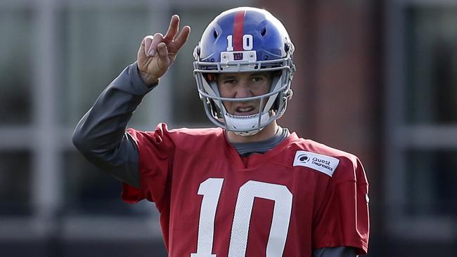 New York Giants quarterback Eli Manning participates in practice.