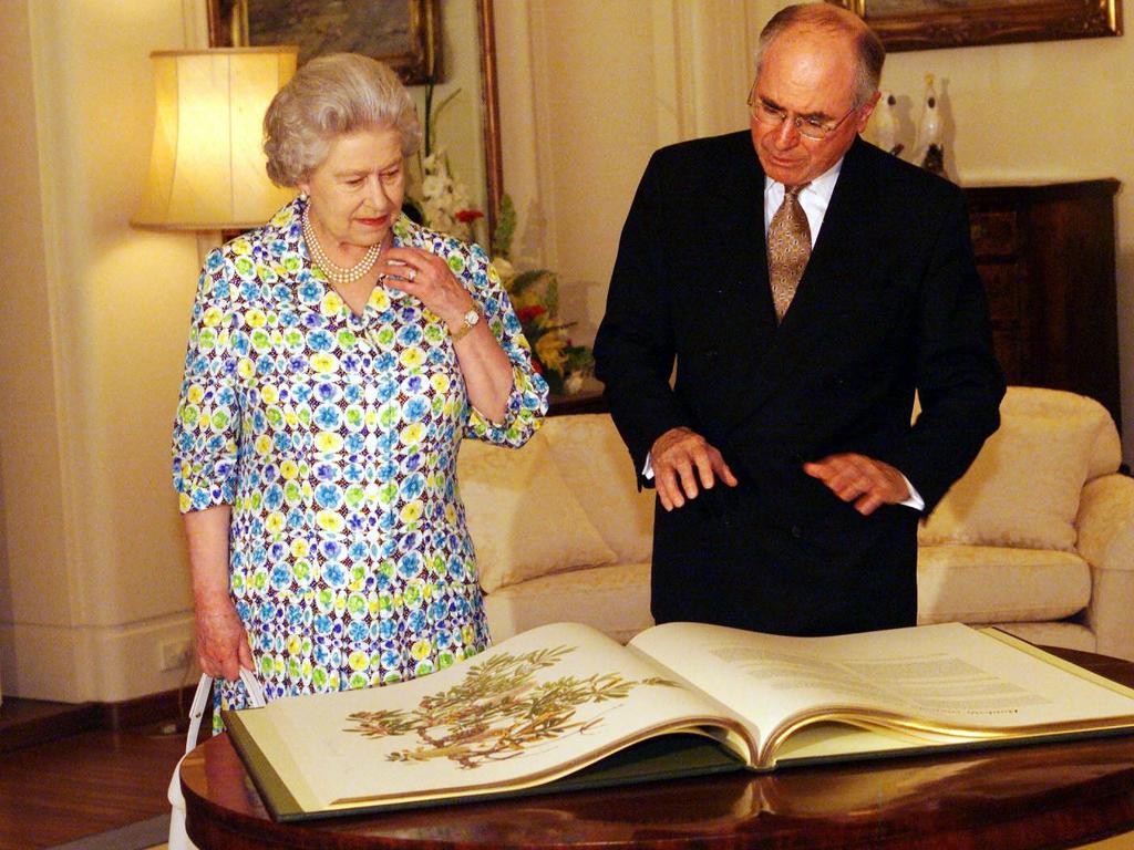 2000: Queen Elizabeth II and Prime Minister John Howard at Yarralumla in Canberra where she was presented a gift from Australia, The Banksias, a botanic reference book. Picture: News Corp Australia