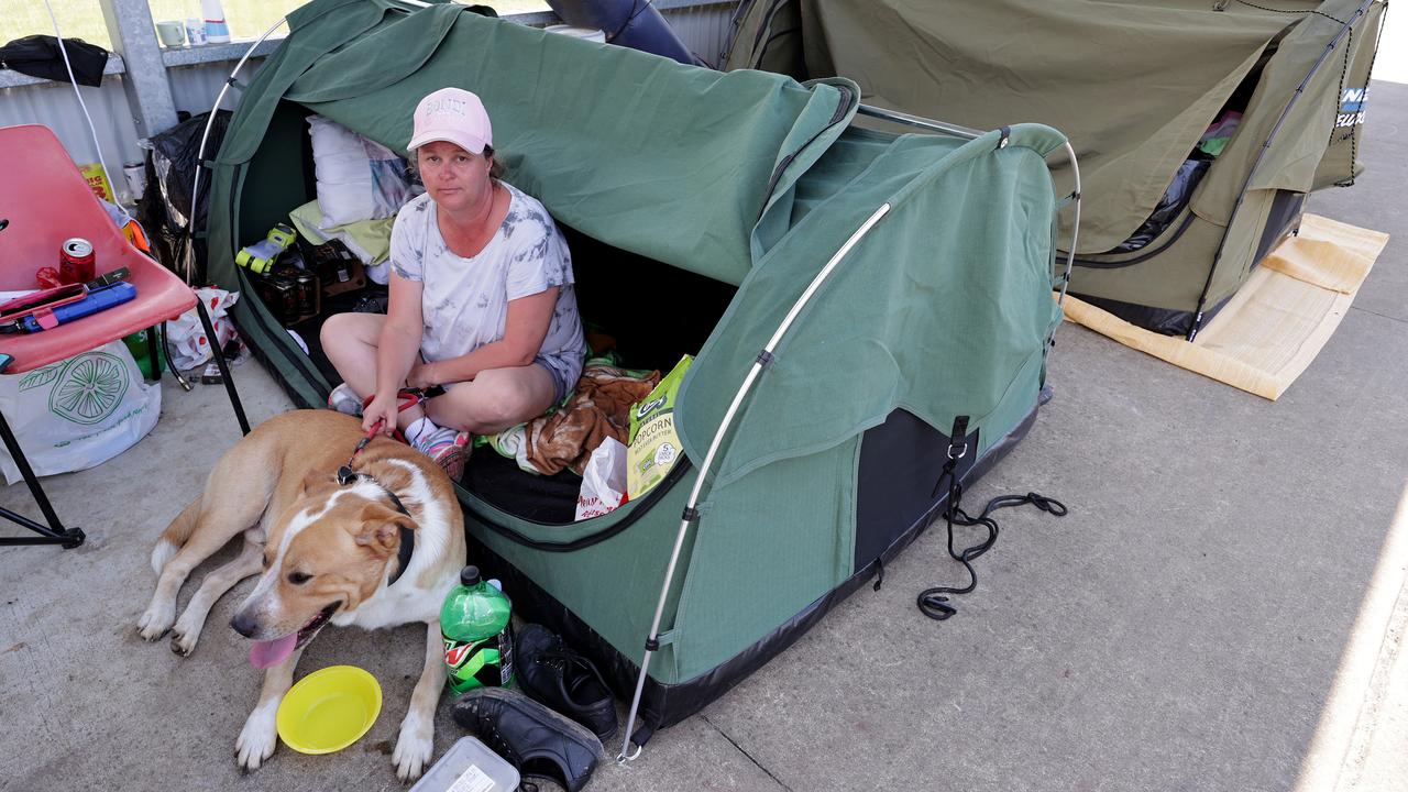 Linda Hawke and dog Bill have been sleeping in a tent underneath the bus shelter in Coraki for the last week. Picture: Toby Zerna