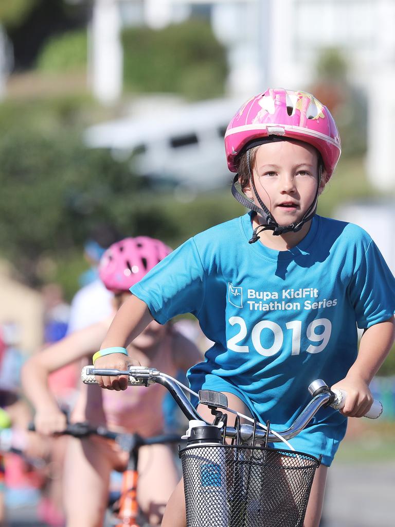 Participants competing in the Bupa KidFit Series triathlon beginning their cycling leg at Blackmans Bay Beach. Picture: LUKE BOWDEN