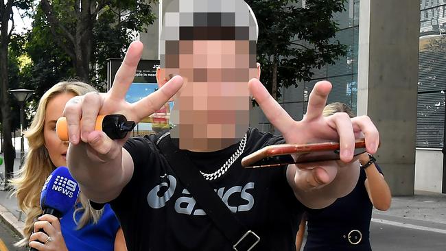 The teen outside court last month where he unleashed a tirade at reporters. Picture: John Gass