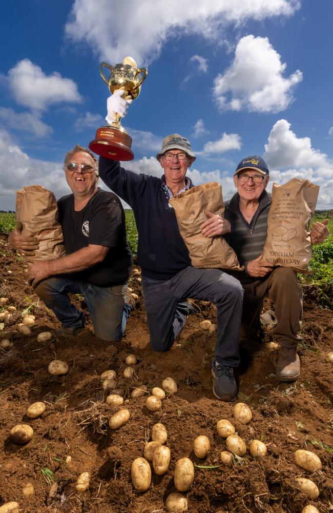 Koroit, VIC: From spuds to stakes - the Melbourne Cup tour meets potato farmers Paul McCutcheon, Leo Carey and Jack McCutcheon in their potato field. Picture: Jay Town