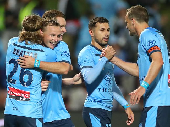 SYDNEY, AUSTRALIA - NOVEMBER 17: Rhyan Grant of Sydney FC and Luke Brattan of Sydney FC celebrate with Kosta Barbarouses of Sydney FC and Alex Wilkinson of Sydney FC celebrating a goal by Barbarouses during the round 6 A-League match between Sydney FC and Melbourne Victory at Netstrata Jubilee Stadium on November 17, 2019 in Sydney, Australia. (Photo by Cameron Spencer/Getty Images)