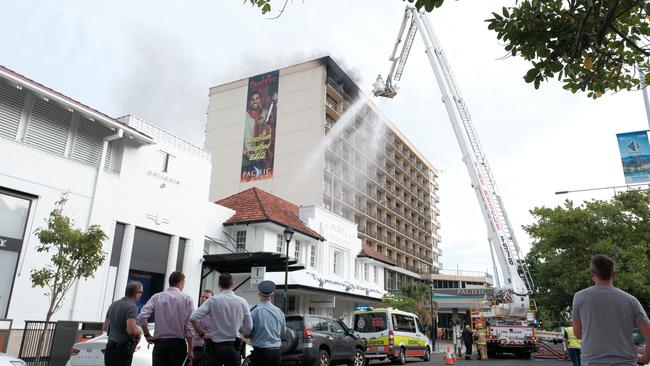 Emergency services respond to a fire in the top floor of the Pacific Hotel on Sunday.