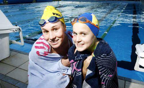 Woogaroo Swim Club nippers Krystle Clarke and Sophie Greenall feel the chill of the winter weather when they start training at 5.30am. . Picture: Claudia Baxter