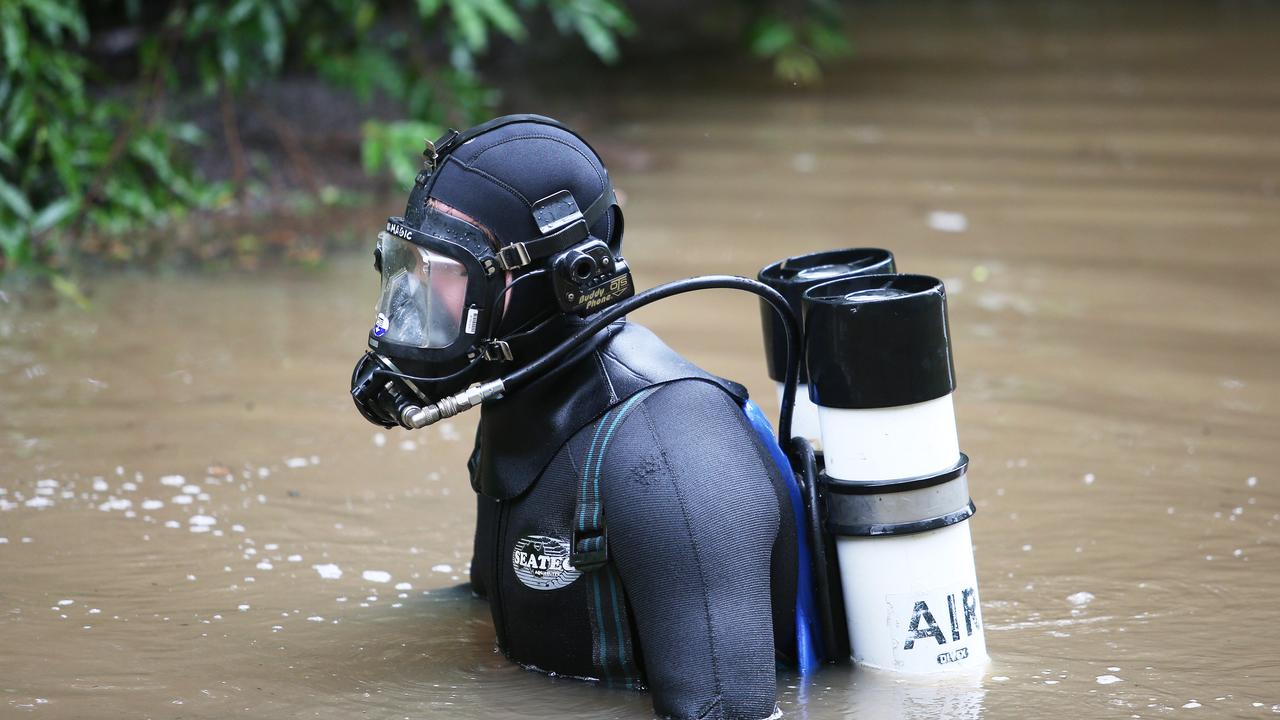Police divers search a dam less than 500 metres from the dig site on Batar Creek Rd. Picture: NCA NewsWire/Peter Lorimer.