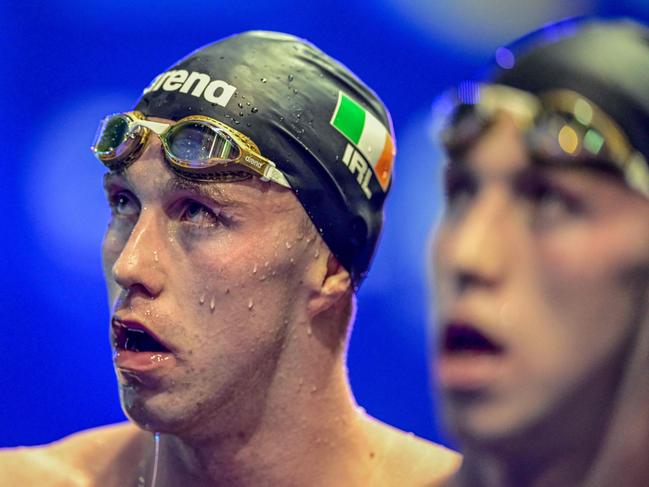 Winner Ireland's Daniel Wiffen (L) and eighth-placed Ireland's Nathan Wiffen (R) look on after the men's 1500m freestyle final event  of the European Short Course Swimming Championships in Otopeni December 7, 2023. (Photo by Daniel MIHAILESCU / AFP)