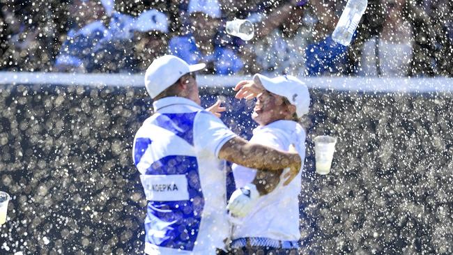 Chase Koepka of the Smash celebrates a hole in one with his caddie on the 12th showered in beer from the crowd during day three of Liv Golf Adelaide. Picture: Mark Brake