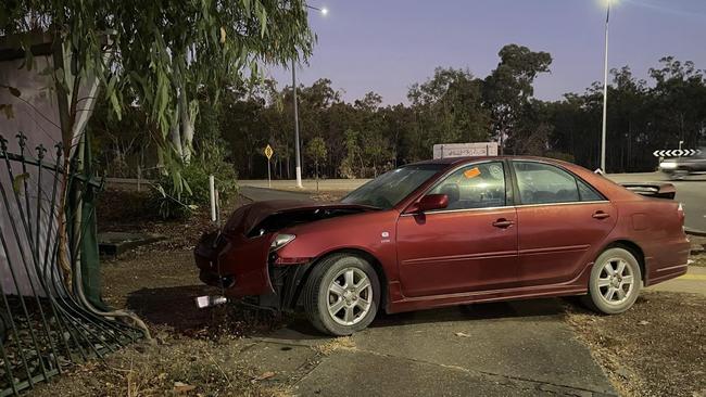 Two people could be seen via CCTV footage fleeing a red Toyota sedan after they crashed it into a fence surrounding a Driver, Palmerston, home.