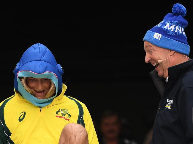 Adam Gilchrist (left) and Neale Daniher participate in Big Freeze 3 before the Round 12 AFL match between the Melbourne Demons and the Collingwood Magpies. Picture: AAP