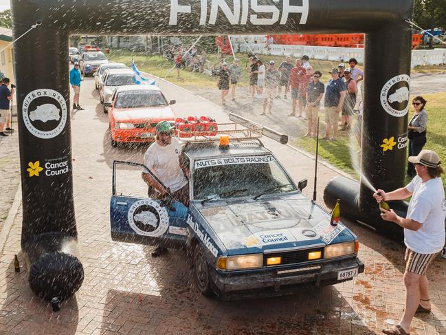Day 7: Hughenden to Townsville — The champagne flowing like the end of a Grand Prix. Photo: BOX RALLIES
