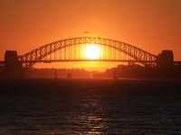 The Sun sets behind the Sydney Harbour bridge pictured from Milk Beach, Vaucluse. 12th September, 2020. 
Picture by Damian Shaw