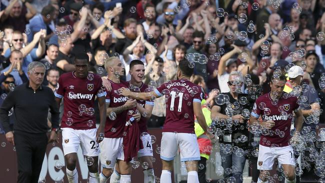 Jose Mourinho (L) looks on as Marko Arnautovic scores the Hammers’ third goal.