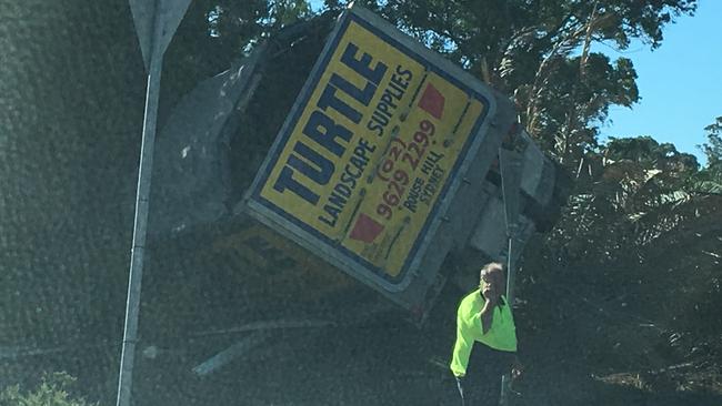 The truck on its side in a yard at the corner of Glenhaven Rd and Bannerman Rd, Kenthurst.