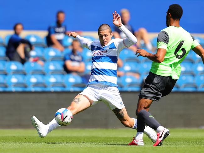 LONDON, ENGLAND - AUGUST 22: Terell Thomas of AFC Wimbledon is challenged by Lyndon Dykes of Queens Park Rangers during the Pre-Season Friendly between Queens Park Rangers and AFC Wimbledon at The Kiyan Prince Foundation Stadium on August 22, 2020 in London, England. (Photo by James Chance/Getty Images)