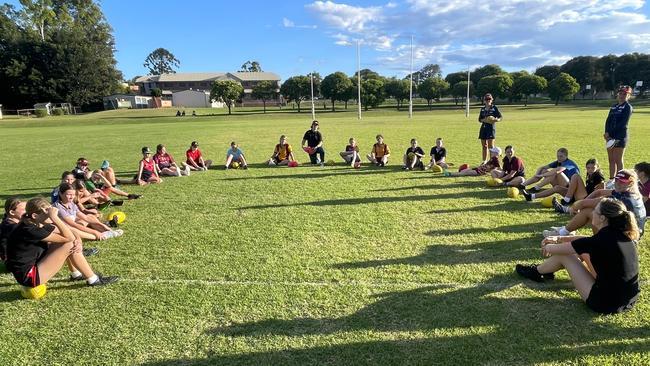 Current and former AFLW stars Casidhe Simmons, Tay Smith and Luka Yoshida-Martin pass on their knowledge to aspiring Darling Downs Aussie Rules stars.