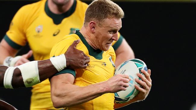 SAPPORO, JAPAN - SEPTEMBER 21: Reece Hodge of Australia is tackled by Semi Radradra of Fiji during the Rugby World Cup 2019 Group D game between Australia and Fiji at Sapporo Dome on September 21, 2019 in Sapporo, Hokkaido, Japan. (Photo by Dan Mullan/Getty Images)