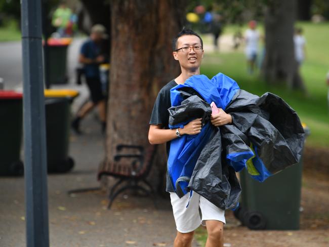 A man is seen running to Mrs Macquarie's Point in preparation for New Years Eve Fireworks in Sydney, Monday, December 31, 2018. Picture: AAP / Brendan Esposito