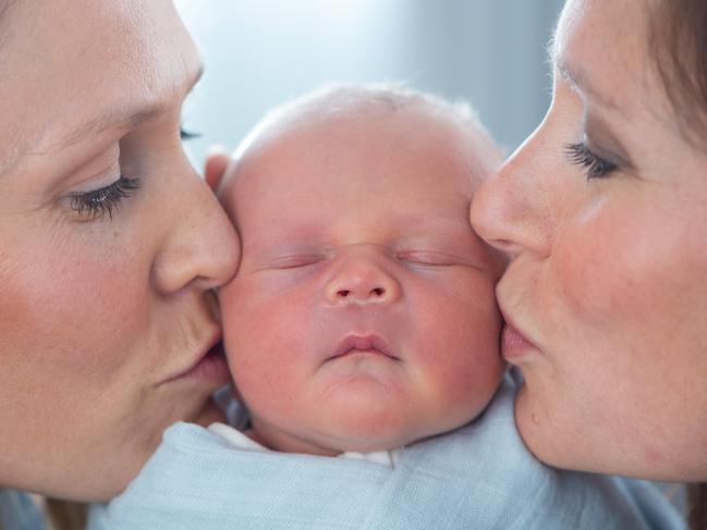 Penny Hansen with baby William Davey and her sister, and surrogate, Fiona Davey. Picture: Jay Town