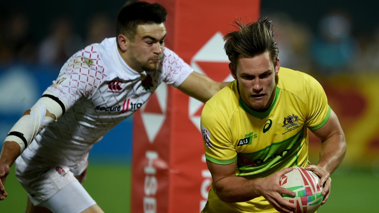 Lachie Anderson of Australia scores a try during the bronze playoff in Dubai.