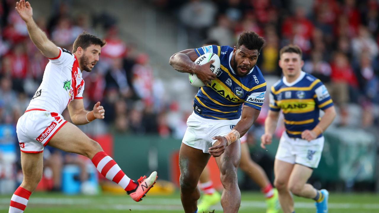 Maika Sivo of the Eels makes a break as he barges past Ben Hunt