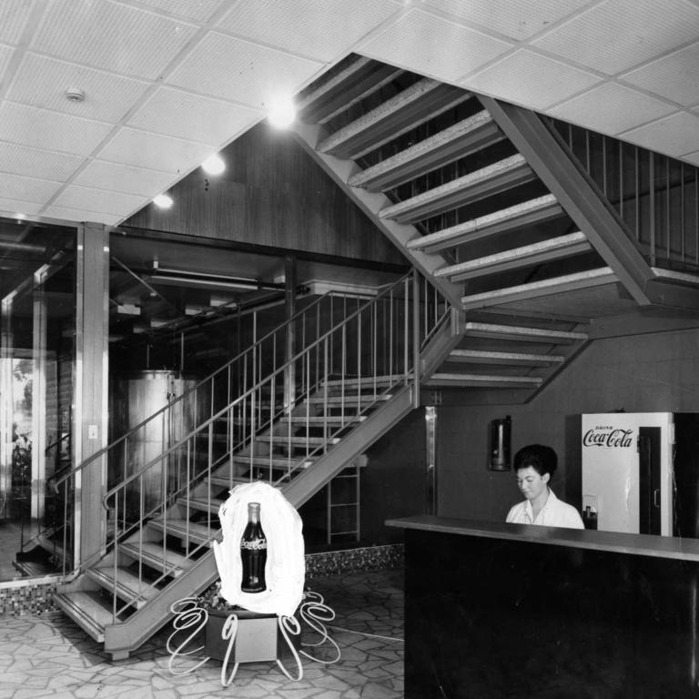 The new office block, built recently for Coca-Cola Bottlers (Adelaide) Ltd., at Port Road, Thebarton, had an attractive vestibule featuring a giant-sized replica of the fluted bottle which is known in almost every corner of the world. August 30, 1961. Picture: R Hewett