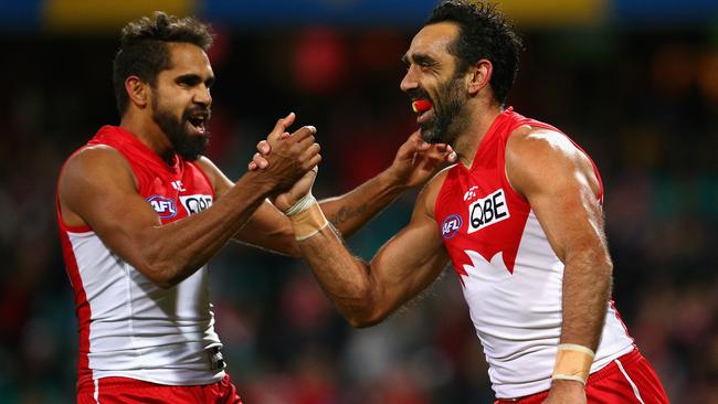 SYDNEY, AUSTRALIA - JULY 02: Adam Goodes of the Swans celebrates kicking a goal with team mate Lewis Jetta during the round 14 AFL match between the Sydney Swans and the Port Adelaide Power at SCG on July 2, 2015 in Sydney, Australia. (Photo by Cameron Spencer/Getty Images)