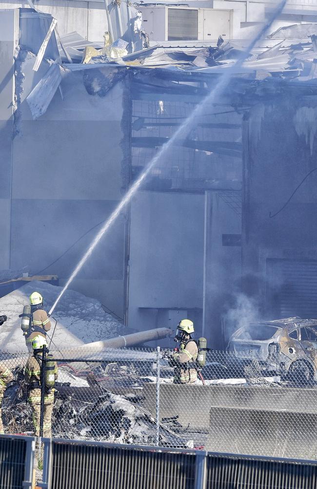 Firefighters are confronted with the wreckage. Picture: Jason Edwards