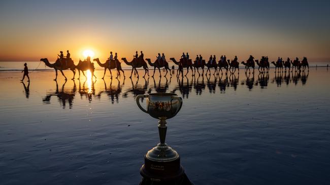 Broome, WA: The Melbourne Cup cruises the sands of Cable Beach with these camel companions. Picture: Colin Murty