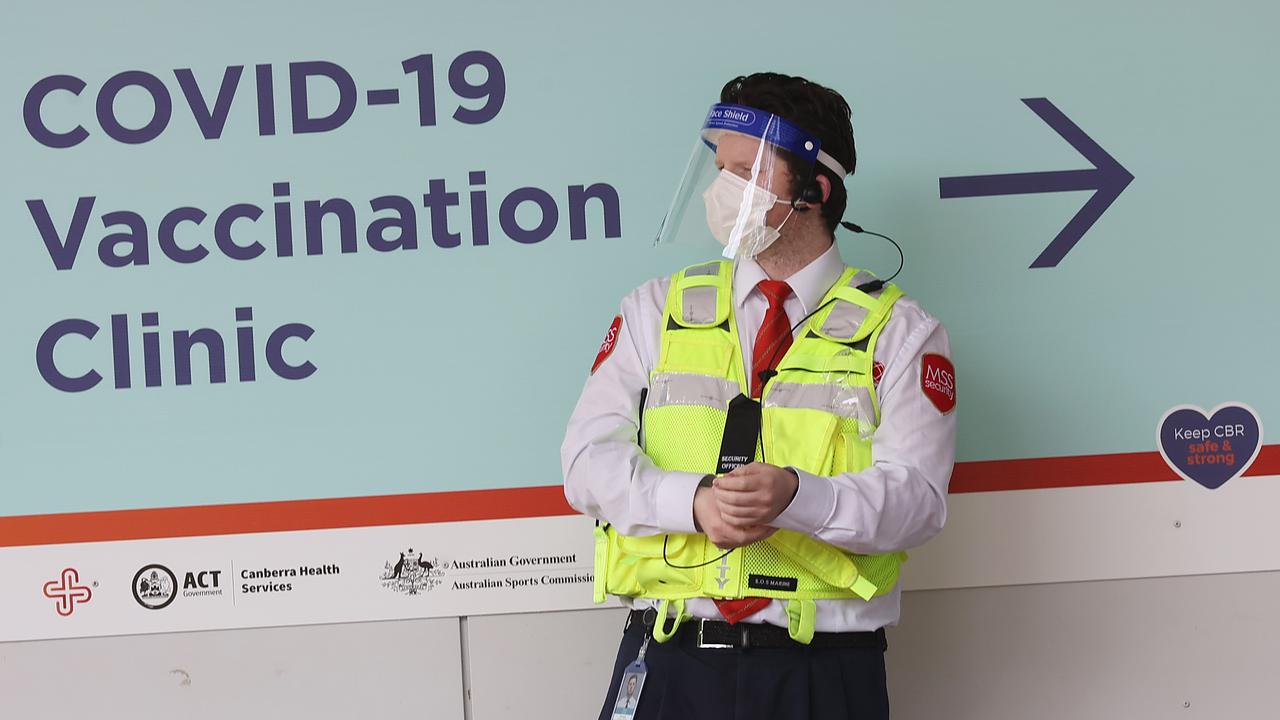 A security guard at the Covid-19 mass vaccination clinic at the Australian Institute of Sport Arena in Canberra. Picture: Gary Ramage / NCA NewsWire