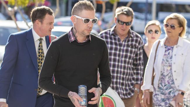 David Turner (second from left), husband of victim Kate Goodchild is seen arriving at the inquest into the Dreamworld disaster at the Southport Courthouse on June 22, 2018.