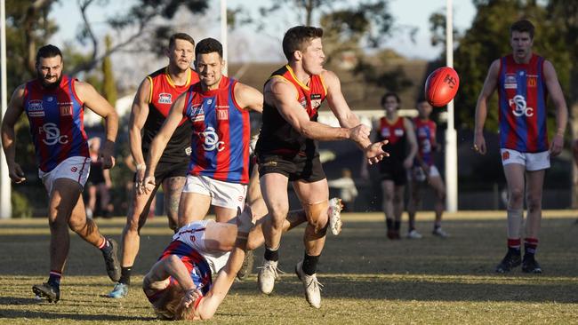 SFNL: Dingley’s Jackson Peet gets a handball away. Picture: Valeriu Campan