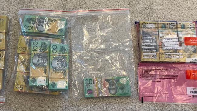 Bags of cash among $160,000 allegedly seized from a safe at a Gold Coast home. Picture: Australian Federal Police