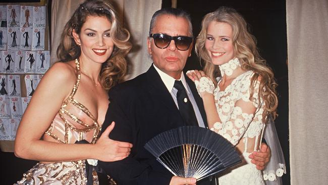 Cindy Crawford, Karl Lagerfeld and Claudia Schiffer, during the Chanel fashion show in Paris, 1993. Picture: Rindoff Petroff/Castel/Getty Images