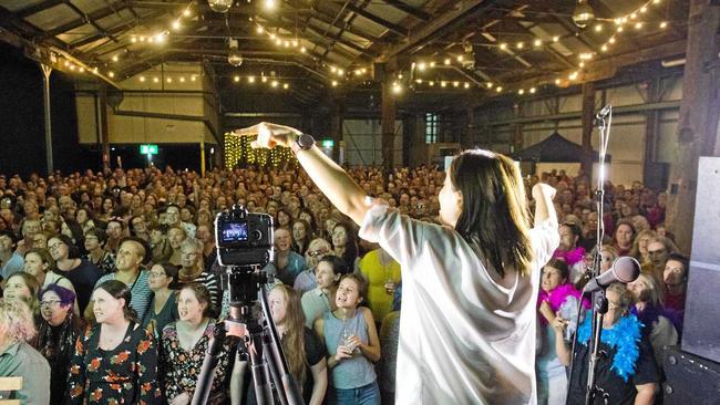 Astrid Jorgensen conducts the Pub Choir at the Blank Space, Toowoomba. More than five hundred have booked for Rockhampton's turn tonight. Picture: Nev Madsen