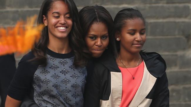 Happy troika: First Lady Michelle Obama with Malia and Sasha in China earlier this year Pic: Feng Li/Getty Images