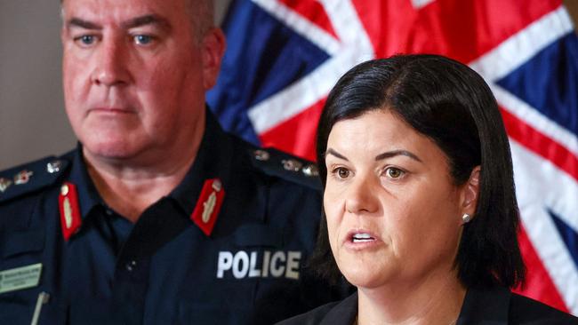 Natasha Fyles (R), Chief Minister of the Northern Territory, speaks as Michael Murphy, the Northern Territory's police commissioner, stands behind during a press conference in Darwin. (Photo by DAVID GRAY / AFP)