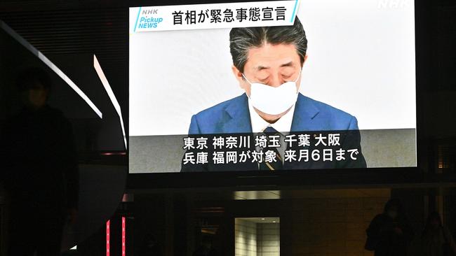 A screen shows news footage of Japanese Prime Minister Shinzo Abe in Tokyo on April 7 as he declared a month-long state of emergency. Picture: AFP