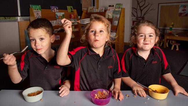 Hunter Turner, Shelby Pearson and Gabriella Prestige enjoying their hot meal of Mexican rice at Clarendon Vale Primary School. Picture: Linda Higginson