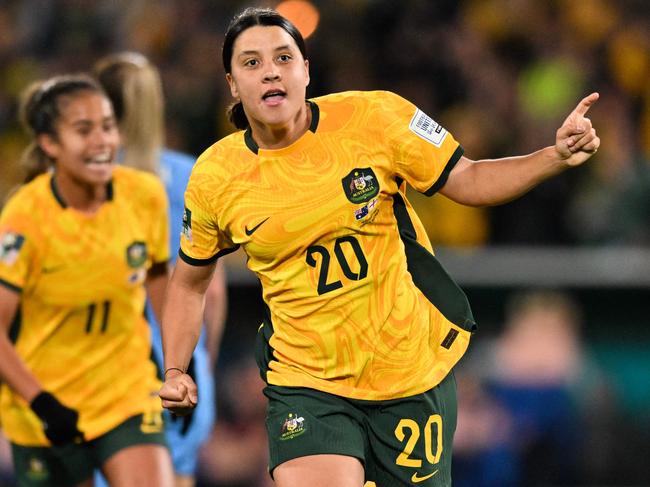 FILES-- This file photo taken on August 16, 2023 shows Australia's forward Sam Kerr celebrating scoring her team's first goal during the Australia and New Zealand 2023 Women's World Cup semi-final football match between Australia and England at Stadium Australia in Sydney. Chelsea and Australian women's football star Sam Kerr has been charged with a "racially aggravated offence" in Britain following a dispute involving a police officer, London's Metropolitan Police said March 4.  The 30-year-old striker, one of the highest profile and best-paid players in the women's game, was charged following an incident in London in January 2023, a police statement read. (Photo by IZHAR KHAN / AFP)