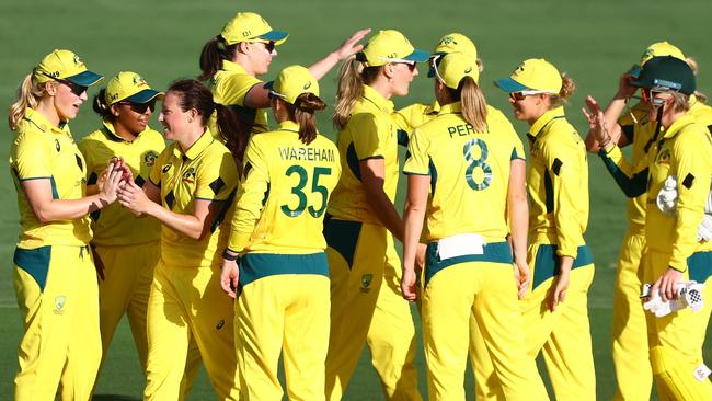 BRISBANE, AUSTRALIA - DECEMBER 05: Megan Schutt of Australia celebrates a wicket during game one of the Women's One Day International Series between Australia and India at Allan Border Field on December 05, 2024 in Brisbane, Australia. (Photo by Chris Hyde/Getty Images)