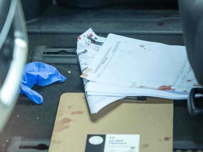 Bloodied documents in the vehicle that was transporting Teu. Picture: Thomas Lisson