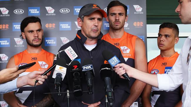 Indigenous Giants Zac Williams, Jeremy Finlayson and Ian 'Bobby' Hill flank coach Leon Cameron as he slams racism in footy. Picture: Phil Hillyard