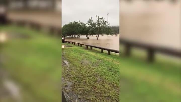 Adrenaline junkies get their fix in flood waters on Coast