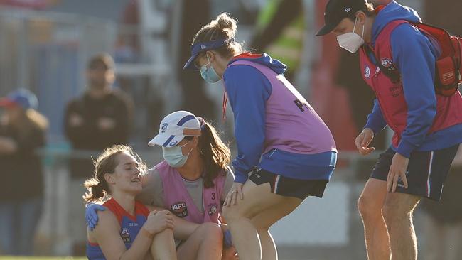 Medics attend to Huntington after injuring her knee in the opening round of AFLW. Picture: AFL Photos via Getty Images