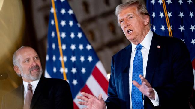 Donald Trump, accompanied by his choice for Secretary of Commerce, Howard Lutnick, speaks at a news conference at Mar-a-Lago. Picture: Getty Images via AFP.