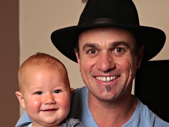 Shannon Noll poses for a photo with his youngest son Colton at his recording studio inside his home in Caringbah on the 18th of September 2019. At home shoot with Shannon Noll.  Photographer: Adam Yip