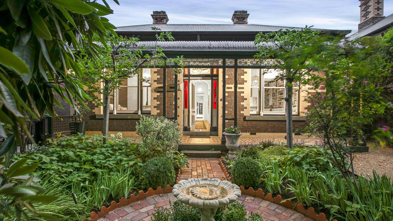 The front garden is planted with greenery that is up to 50 years old.