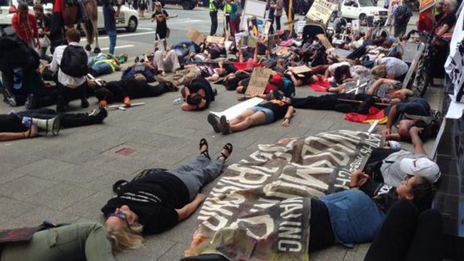 Dozens of protesters lie down on a city street as part of a protest against ongoing deaths in custody in WA. Picture: Channel Nine/Twitter