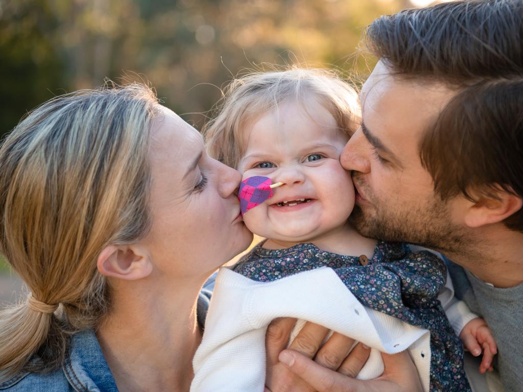 Ellie Martin with her parents Kylie and Andrew in the early days after receiving her new heart. Picture: Jason Edwards